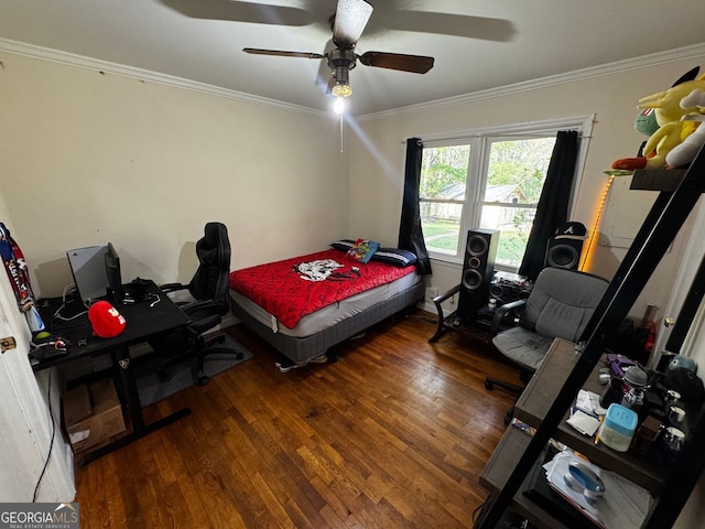 bedroom featuring a ceiling fan, wood finished floors, and ornamental molding