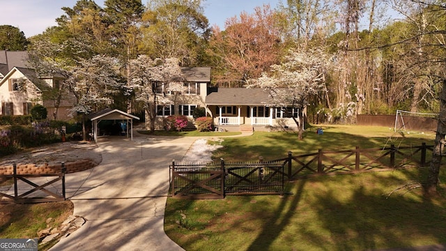 view of property's community with a yard, fence private yard, and a gate