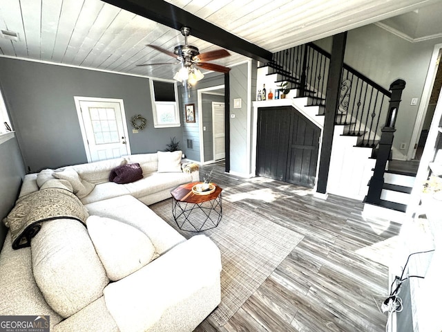 living area featuring wood ceiling, stairway, wood finished floors, and a ceiling fan