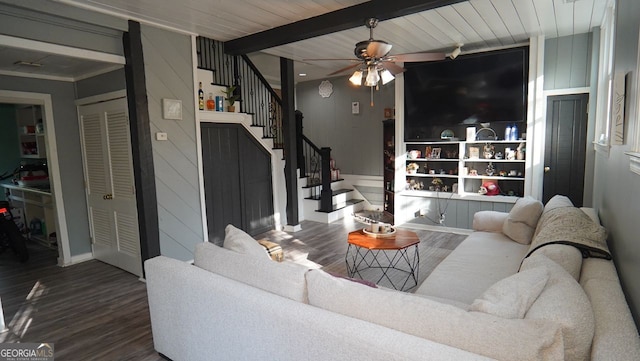 living area with wooden ceiling, ceiling fan, beam ceiling, wood finished floors, and stairs