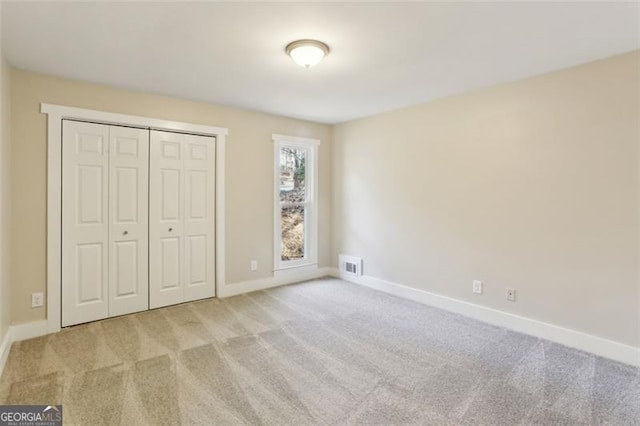 645 Trailmore Pl, Roswell, GA 30076 - unfurnished bedroom featuring carpet and a closet