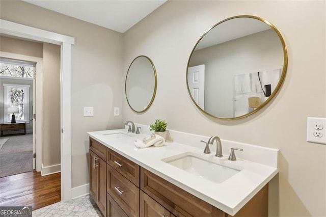 645 Trailmore Pl, Roswell, GA 30076 - bathroom featuring double vanity and wood finished floors