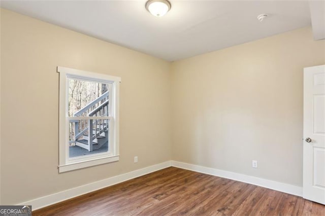 645 Trailmore Pl, Roswell, GA 30076 - spare room with dark wood finished floors and a smoke detector
