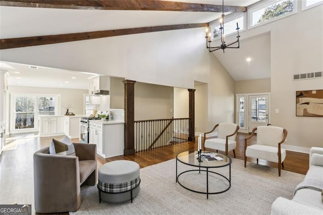 645 Trailmore Pl, Roswell, GA 30076 - living room with high vaulted ceiling, light wood-style floors, decorative columns, beam ceiling, and recessed lighting
