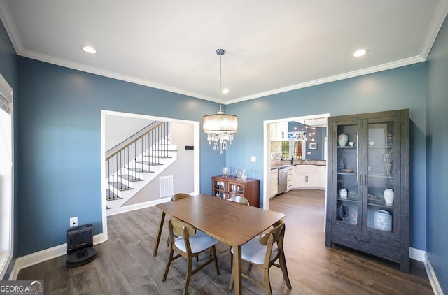 2587 Moons Grove Church Rd, Colbert, GA 30628 - dining area featuring stairs, a chandelier, dark wood-style flooring, crown molding, and recessed lighting