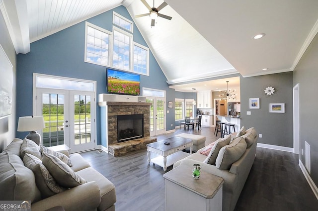 2587 Moons Grove Church Rd, Colbert, GA 30628 - living room with a ceiling fan, dark wood-type flooring, a fireplace, french doors, and high vaulted ceiling