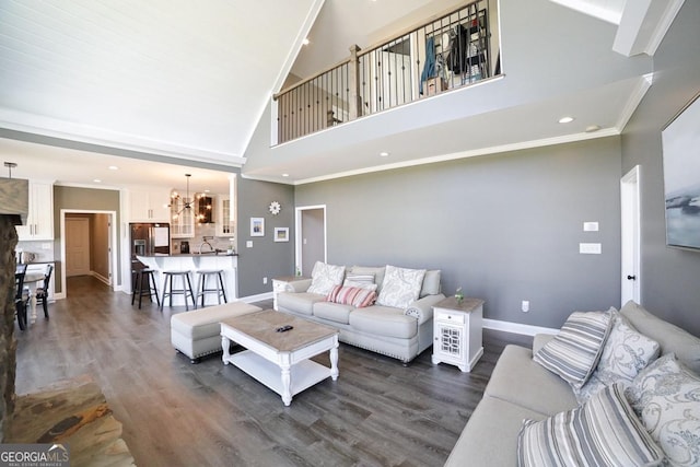 2587 Moons Grove Church Rd, Colbert, GA 30628 - living area with a chandelier, dark wood-type flooring, high vaulted ceiling, recessed lighting, and ornamental molding