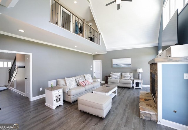 2587 Moons Grove Church Rd, Colbert, GA 30628 - living area with ceiling fan, high vaulted ceiling, dark wood-type flooring, ornamental molding, and stairs