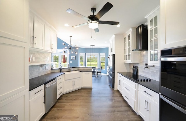 2587 Moons Grove Church Rd, Colbert, GA 30628 - kitchen with appliances with stainless steel finishes, wall chimney exhaust hood, a peninsula, white cabinets, and recessed lighting