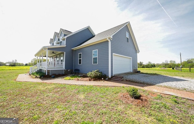 2587 Moons Grove Church Rd, Colbert, GA 30628 - view of property exterior featuring driveway, a porch, a yard, a garage, and a ceiling fan