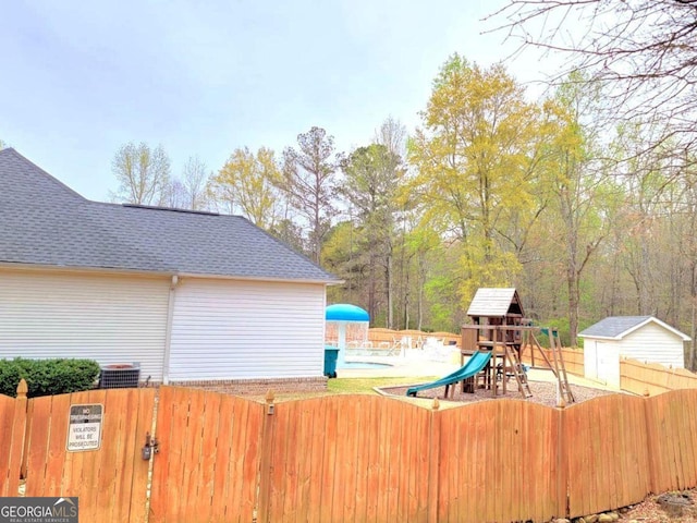 113 Citadel Dr, Hampton, GA 30228 - fenced yard with a storage shed, a community pool, and a playground