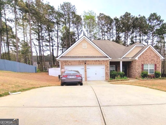 113 Citadel Dr, Hampton, GA 30228 - view of front of home featuring driveway, a garage, and brick siding