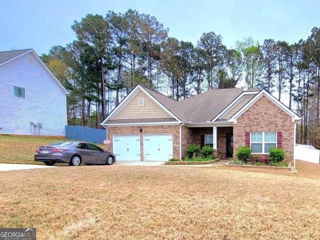 113 Citadel Dr, Hampton, GA 30228 - view of front of property featuring a garage, brick siding, and concrete driveway