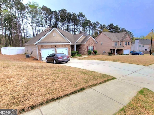 113 Citadel Dr, Hampton, GA 30228 - view of front of property with driveway, a garage, and brick siding