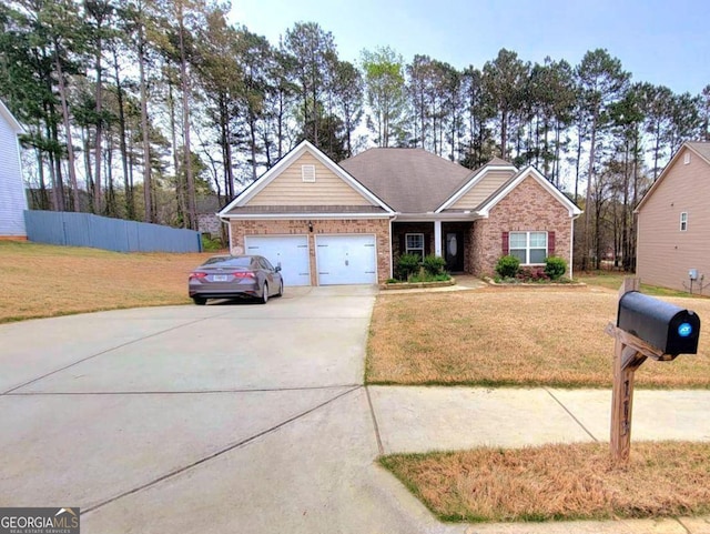 113 Citadel Dr, Hampton, GA 30228 - view of front of home with a garage, concrete driveway, a front lawn, and brick siding