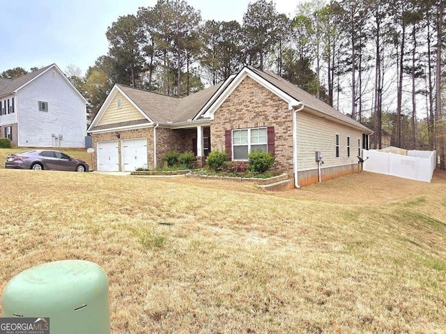 113 Citadel Dr, Hampton, GA 30228 - view of front of house with a garage and brick siding