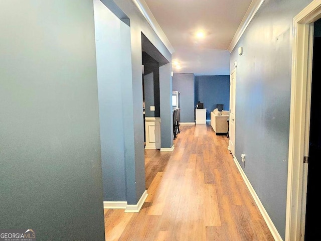 113 Citadel Dr, Hampton, GA 30228 - hallway with light wood finished floors and ornamental molding