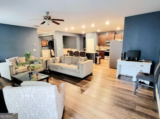 113 Citadel Dr, Hampton, GA 30228 - living room with light wood finished floors, a ceiling fan, and recessed lighting
