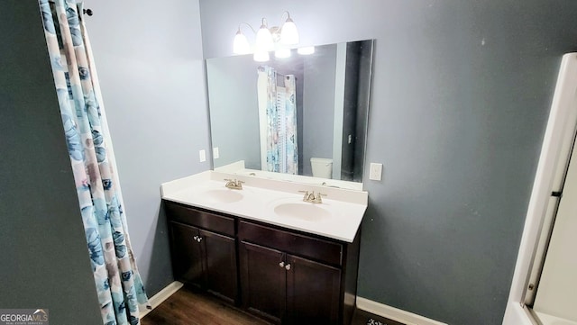 113 Citadel Dr, Hampton, GA 30228 - full bath featuring double vanity and wood finished floors