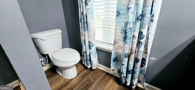 113 Citadel Dr, Hampton, GA 30228 - bathroom featuring wood finished floors and a shower with curtain
