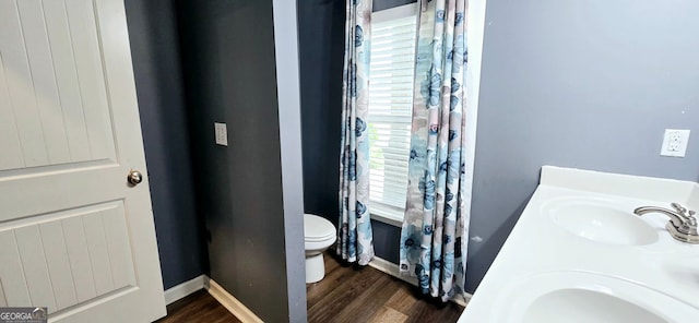 113 Citadel Dr, Hampton, GA 30228 - full bathroom featuring healthy amount of natural light, wood finished floors, and double vanity