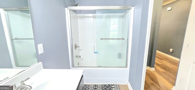 113 Citadel Dr, Hampton, GA 30228 - bathroom with wood finished floors, shower / washtub combination, and vanity
