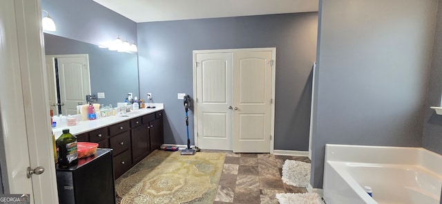 113 Citadel Dr, Hampton, GA 30228 - full bathroom with a bath, vanity, and stone finish floors