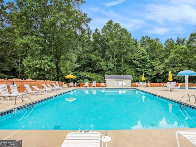 113 Citadel Dr, Hampton, GA 30228 - community pool featuring a patio area and view of scattered trees