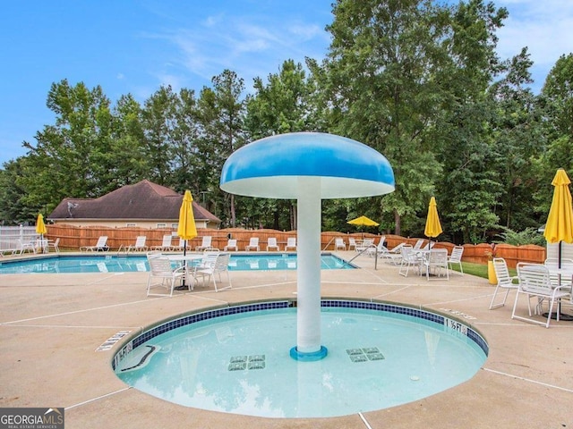 113 Citadel Dr, Hampton, GA 30228 - community pool with a patio area and view of wooded area