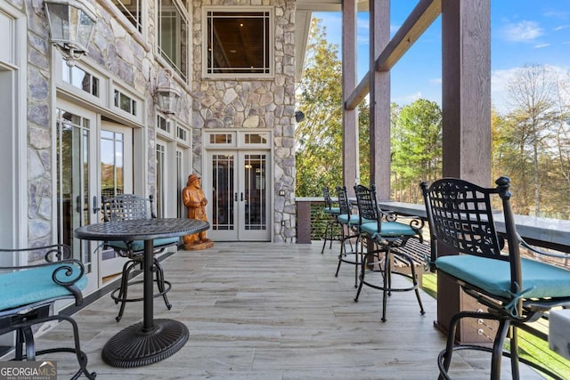 wooden terrace featuring french doors