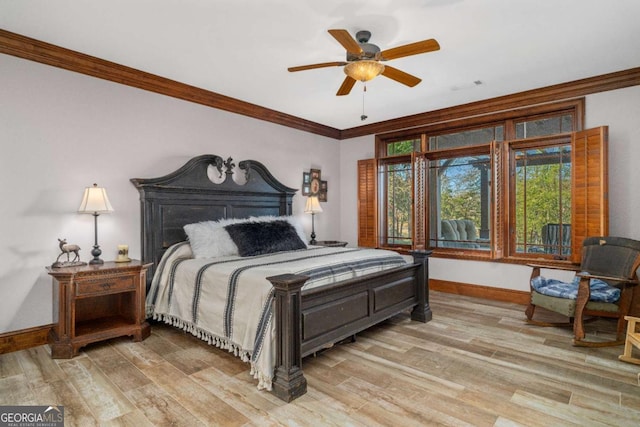 bedroom with ornamental molding, baseboards, and light wood-style flooring