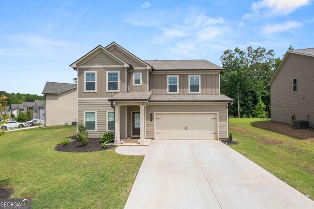 craftsman-style home with concrete driveway, central air condition unit, an attached garage, board and batten siding, and a front lawn