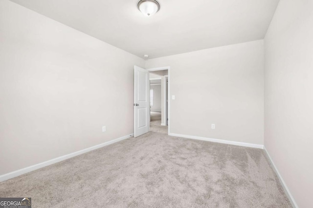 unfurnished bedroom with baseboards and carpet floors