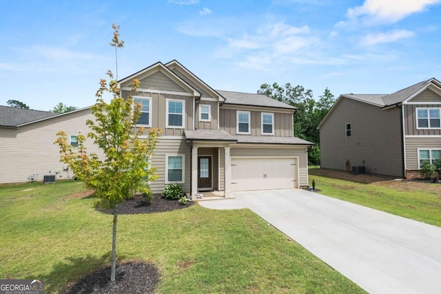 craftsman house with board and batten siding, a front yard, driveway, and a garage