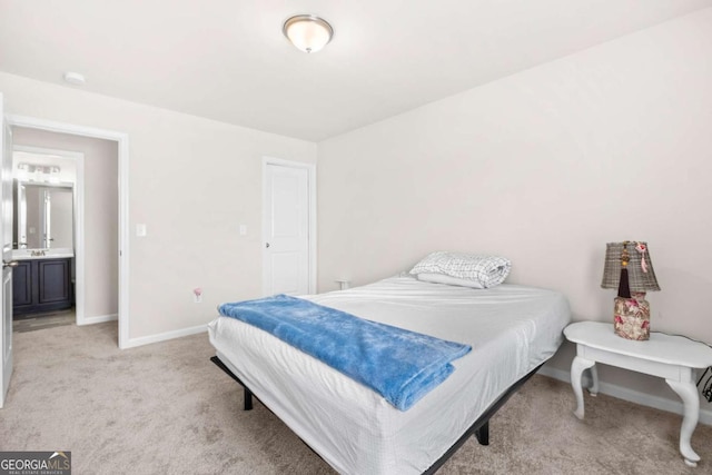 bedroom featuring light carpet and baseboards
