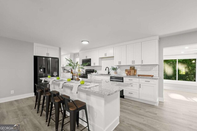 5198 Holly Springs Rd, Pendergrass, GA 30567 - kitchen with refrigerator with ice dispenser, stainless steel electric range oven, dishwasher, a sink, and backsplash