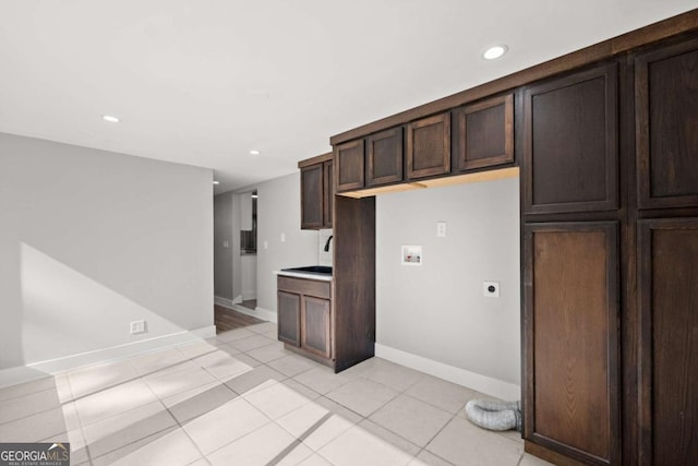 5198 Holly Springs Rd, Pendergrass, GA 30567 - kitchen featuring light countertops, recessed lighting, light tile patterned floors, baseboards, and dark brown cabinets