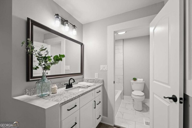 5198 Holly Springs Rd, Pendergrass, GA 30567 - bathroom featuring baseboards, marble finish floor, toilet, and vanity