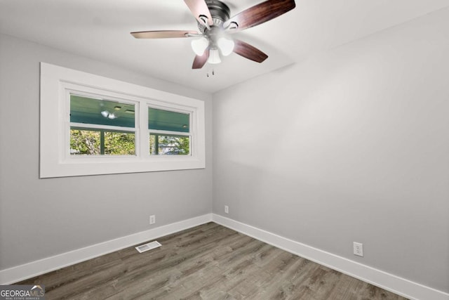 5198 Holly Springs Rd, Pendergrass, GA 30567 - spare room featuring a ceiling fan, wood finished floors, baseboards, and visible vents