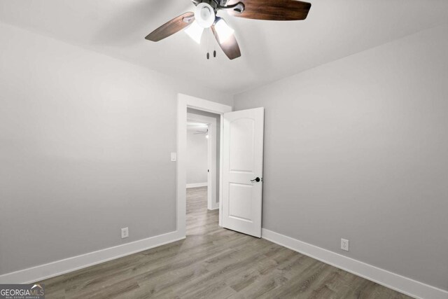 5198 Holly Springs Rd, Pendergrass, GA 30567 - unfurnished room featuring baseboards, ceiling fan, and wood finished floors