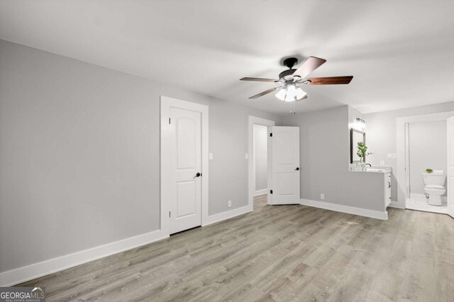 5198 Holly Springs Rd, Pendergrass, GA 30567 - interior space with baseboards, light wood-style floors, and a ceiling fan