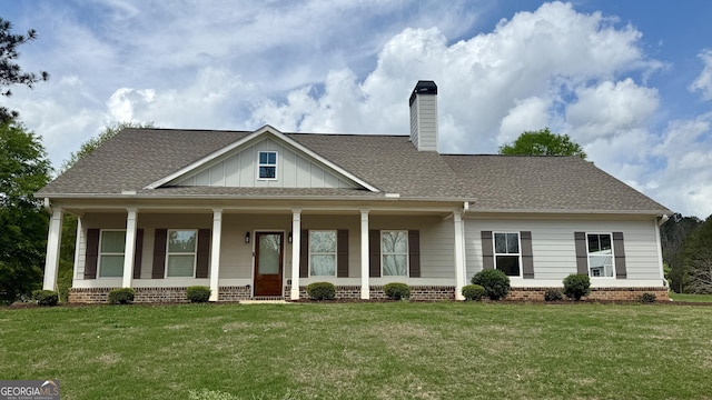 4529 Jersey Covington Rd, Covington, GA 30014 - view of front of property with a chimney, a front lawn, board and batten siding, and brick siding