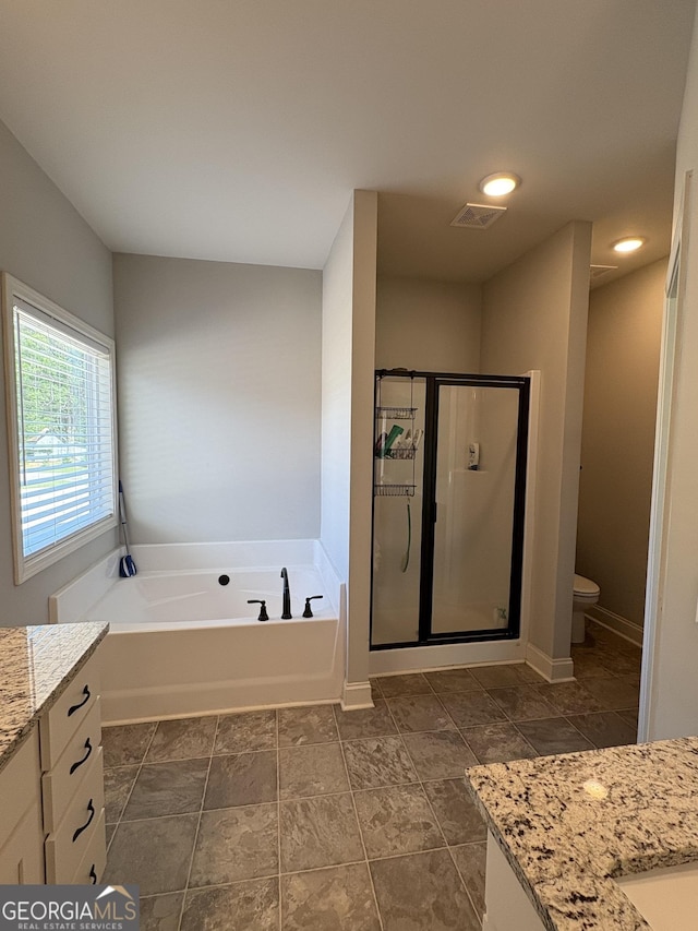 4529 Jersey Covington Rd, Covington, GA 30014 - full bathroom featuring vanity, a stall shower, a bath, toilet, and recessed lighting
