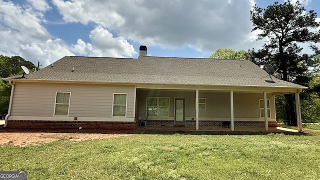 4529 Jersey Covington Rd, Covington, GA 30014 - back of house featuring a lawn, a chimney, and a patio area