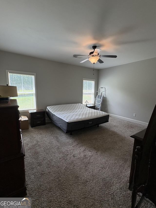 4529 Jersey Covington Rd, Covington, GA 30014 - carpeted bedroom featuring ceiling fan and baseboards