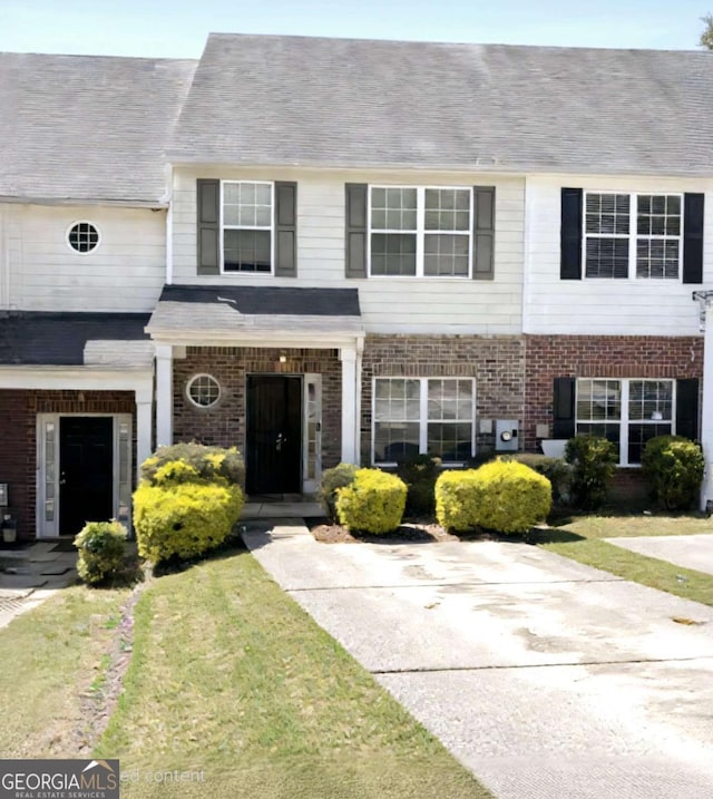 290 Brookview Dr, Riverdale, GA 30274 - townhome / multi-family property featuring a front yard and brick siding