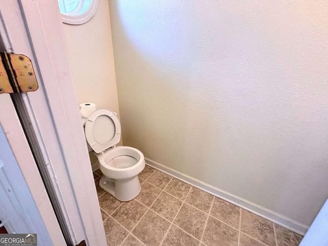 290 Brookview Dr, Riverdale, GA 30274 - bathroom with toilet, baseboards, and tile patterned flooring