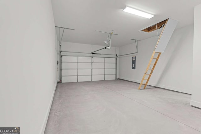 garage featuring electric panel, baseboards, and a garage door opener