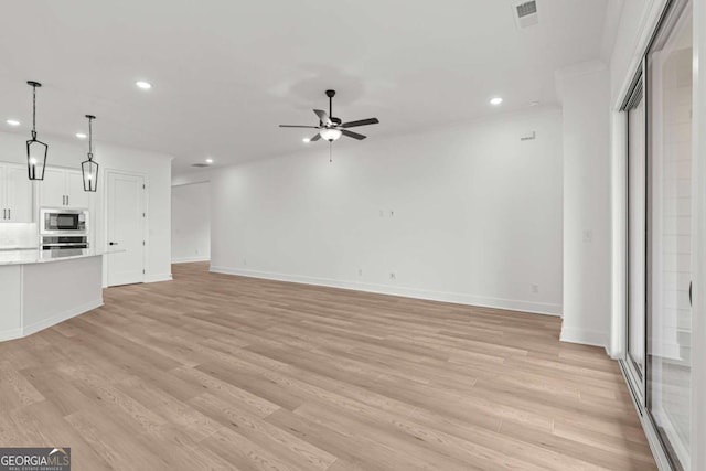 unfurnished living room featuring ceiling fan, visible vents, recessed lighting, and light wood-type flooring