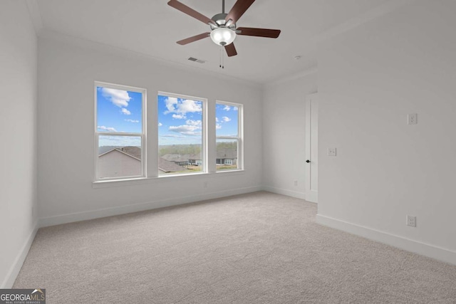 unfurnished room featuring carpet floors, baseboards, ceiling fan, and visible vents
